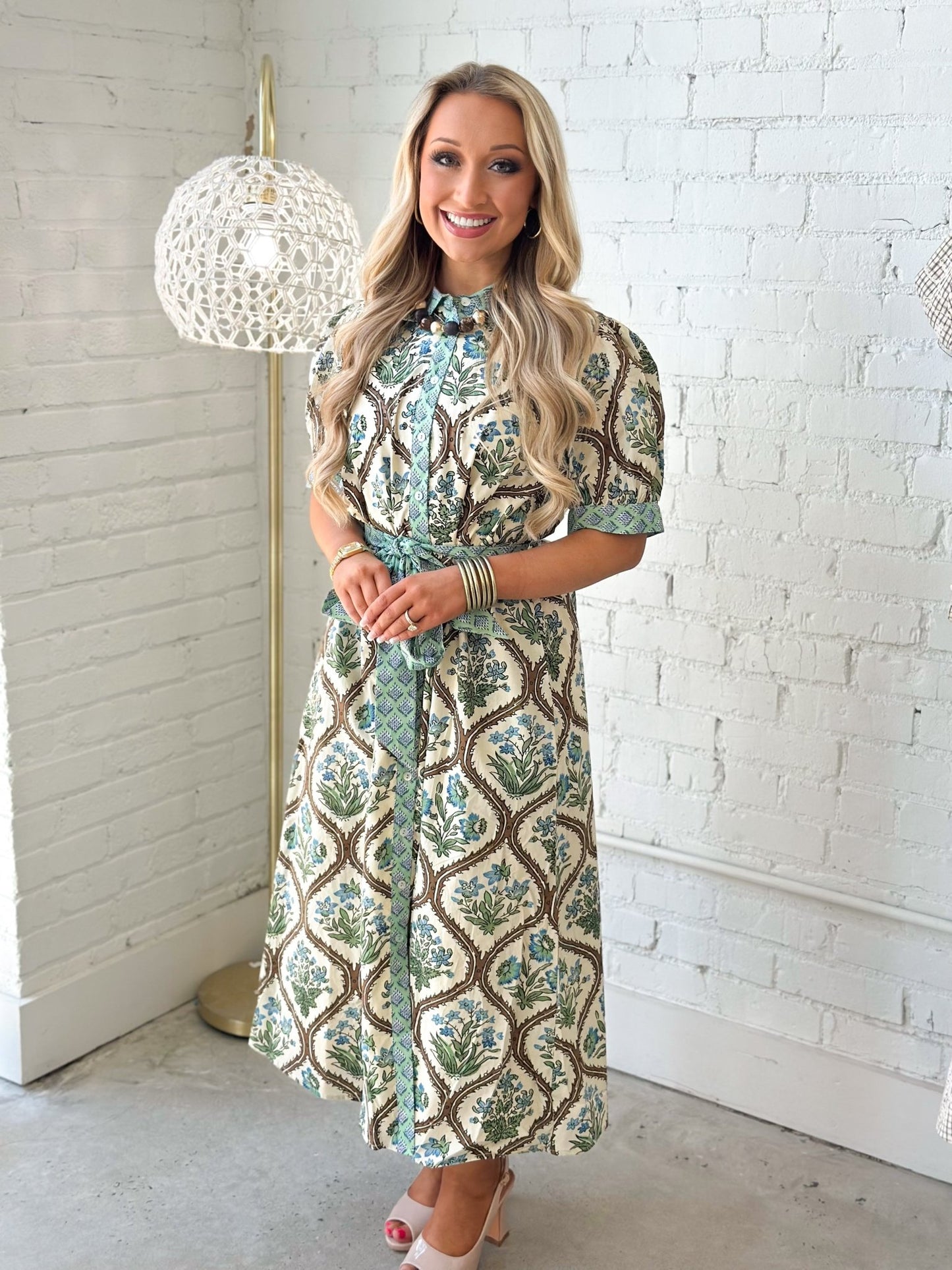 Floral button up dress with a knotted waist tie