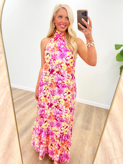 Red floral maxi dress with a long, flowing skirt