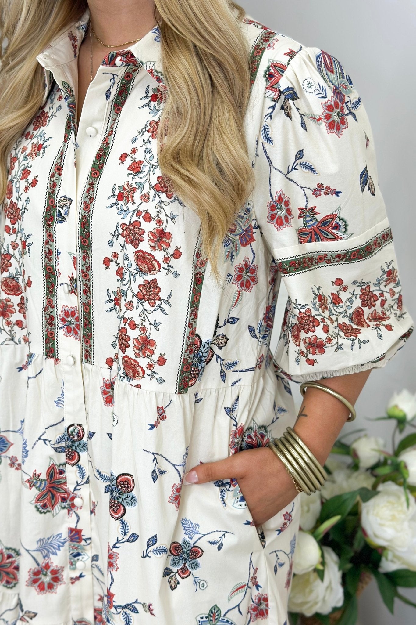 Natural toned floral dress with a full button placket