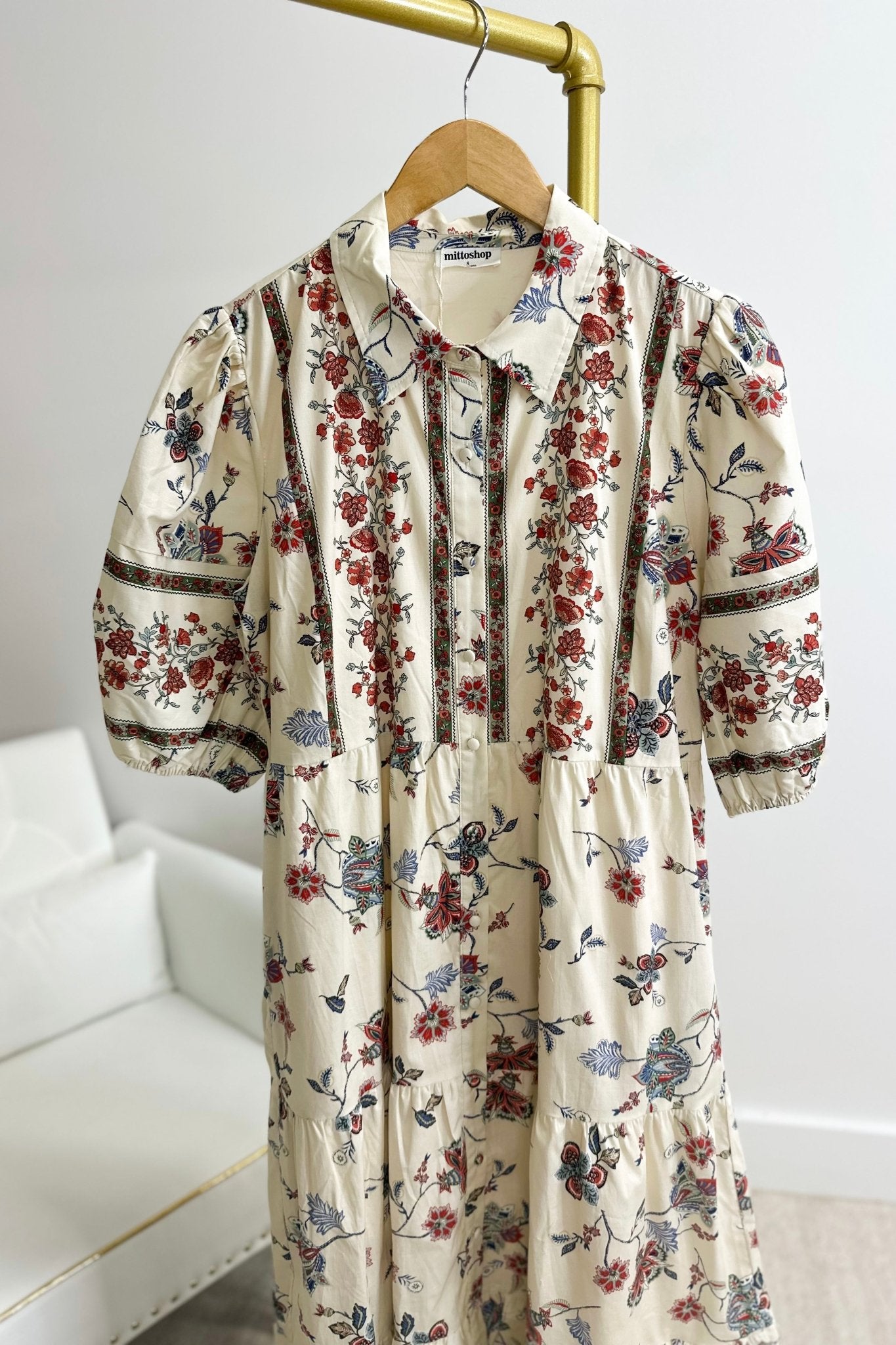 Printed floral dress fastened with front buttons