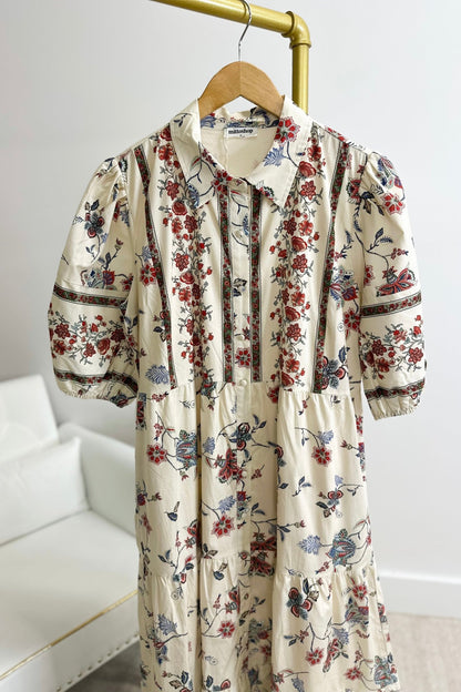Printed floral dress fastened with front buttons