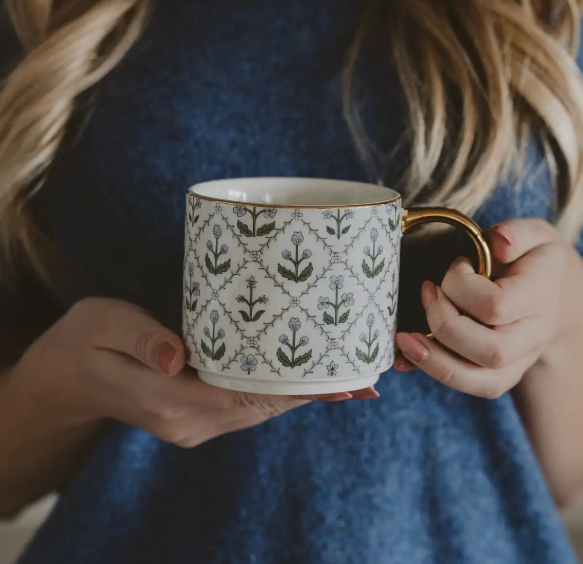 Ceramic coffee mug with a floral quilt pattern