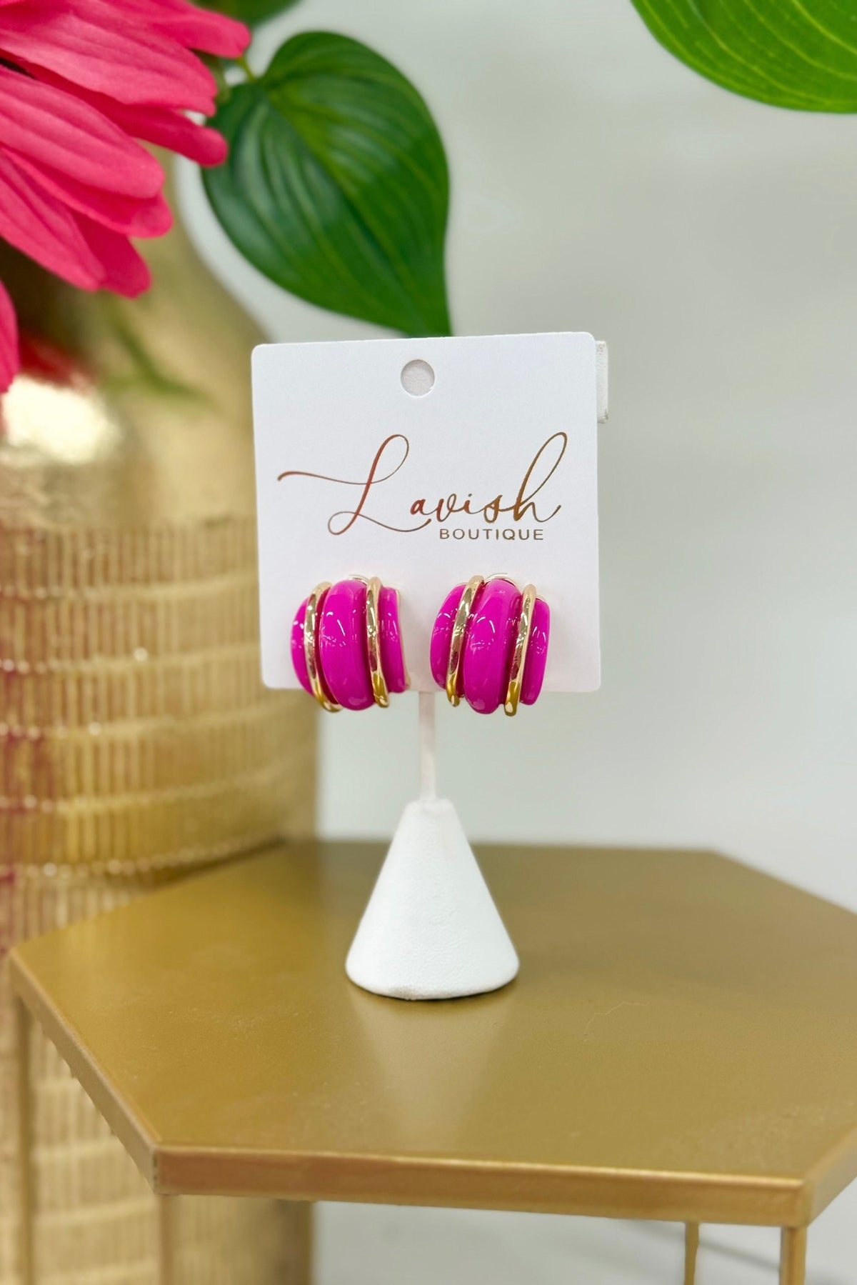 Half hoop earrings layering fuchsia over gold