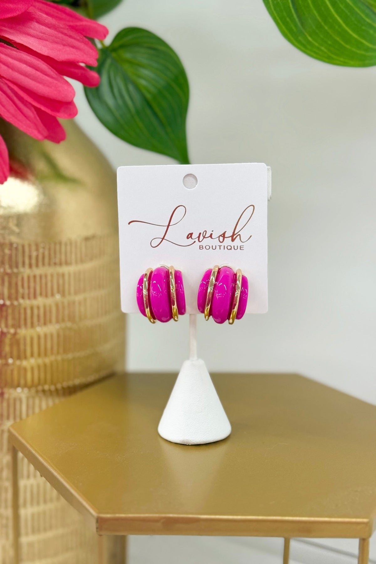 Wide half hoops in fuchsia and gold tones