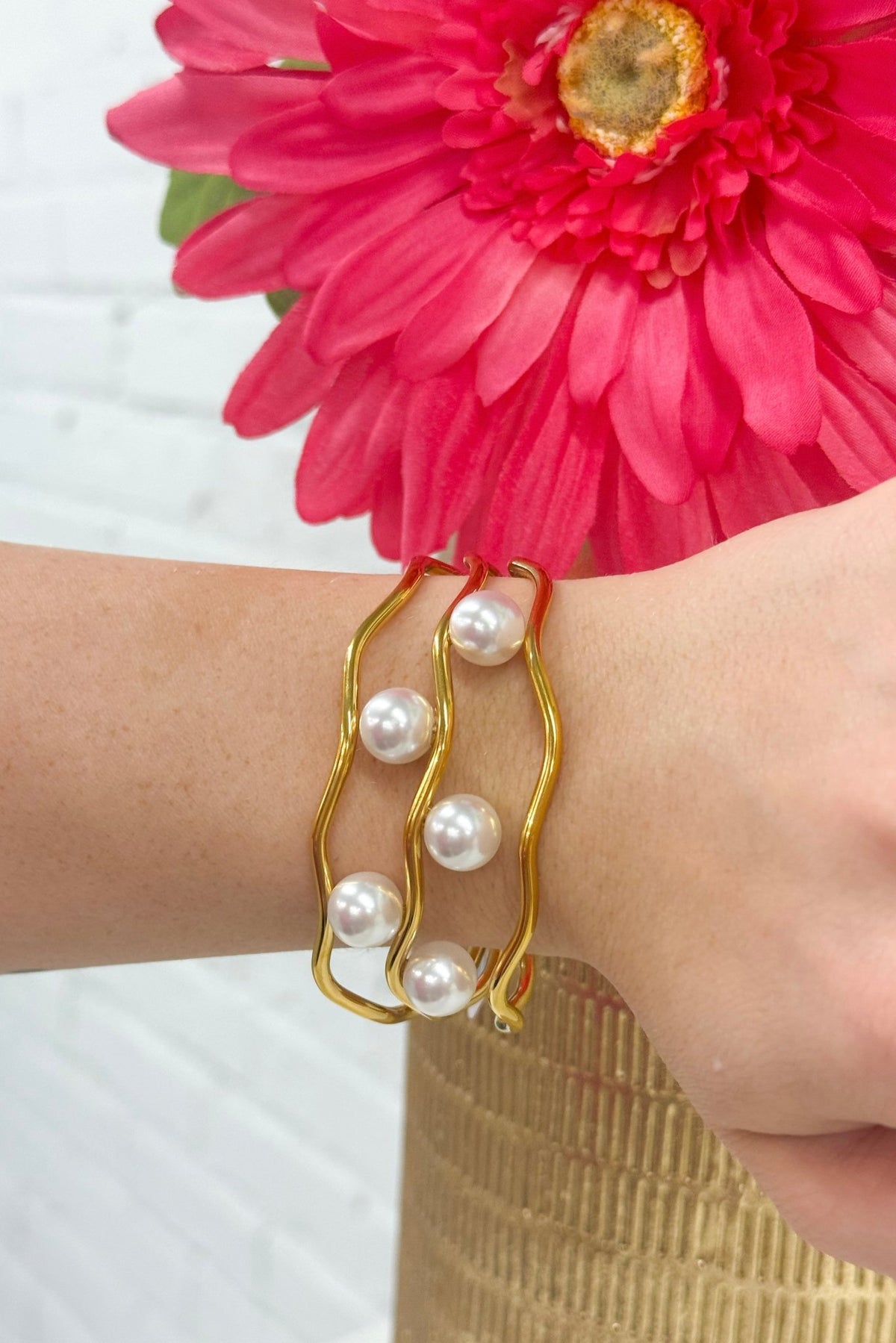 Slim gold bangle set with a pearl