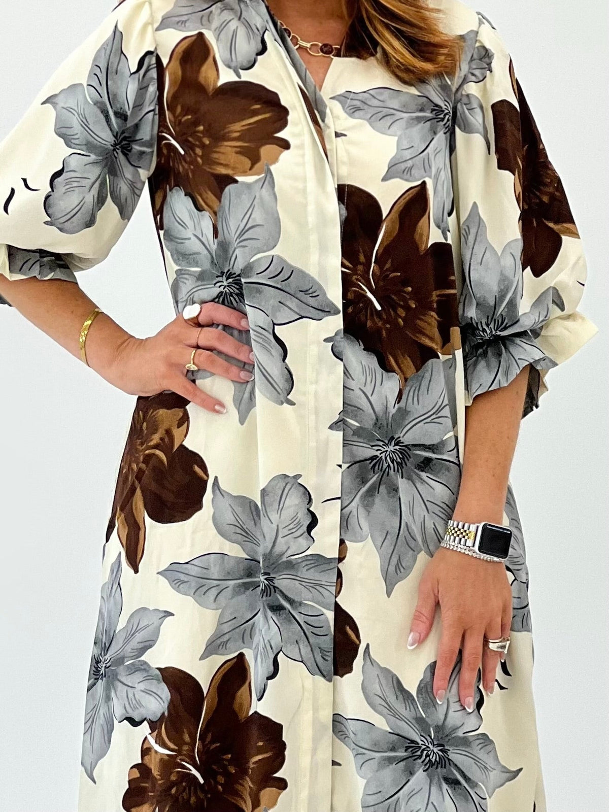 Cream floral maxi dress cut for a fluid, full length silhouette
