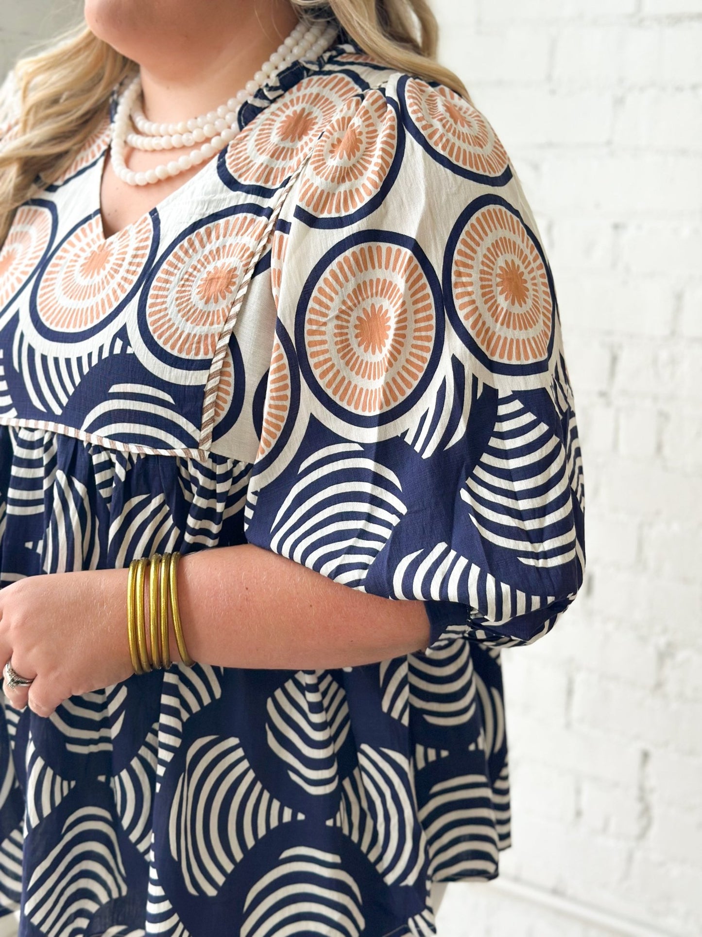 Babydoll blouse with an allover navy print