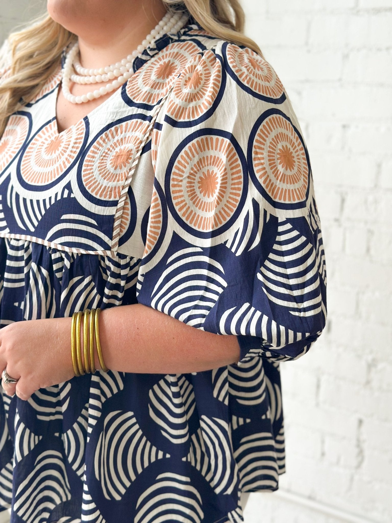 Babydoll blouse with an allover navy print