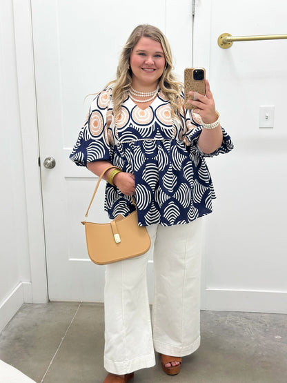 Navy mix print top with a frilled neckline