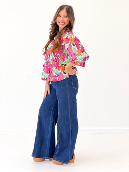 Button down top with ruffles and an allover print