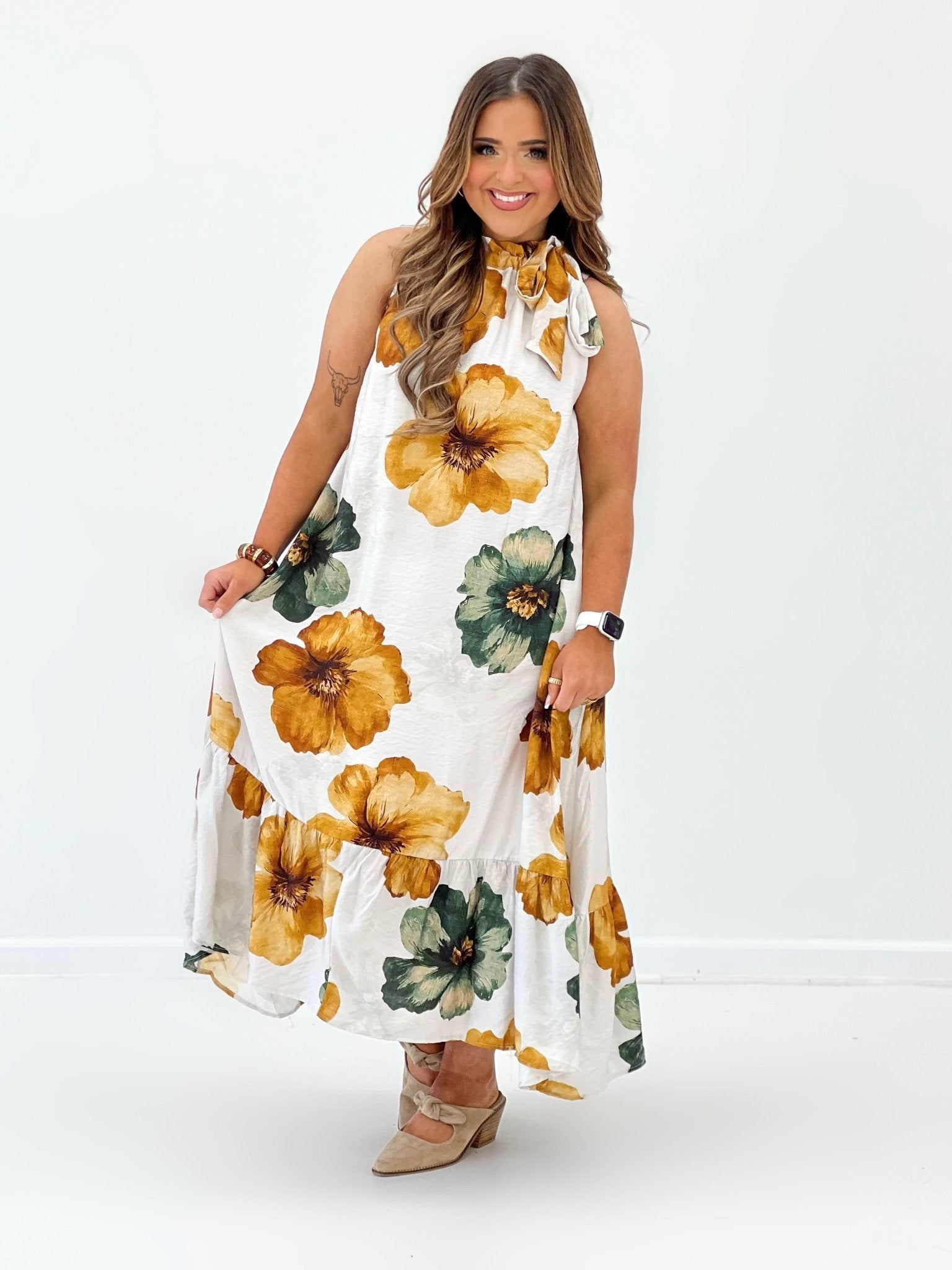 Floral print dress falling to a midi length