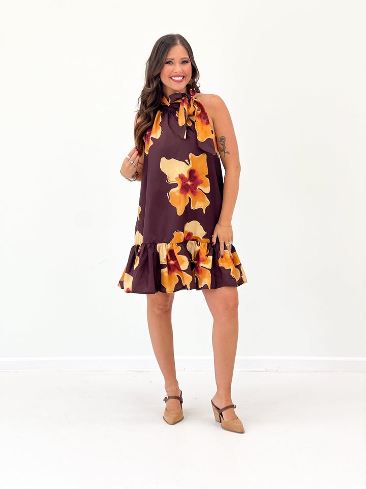 Brick floral print mini dress with a tie neckline