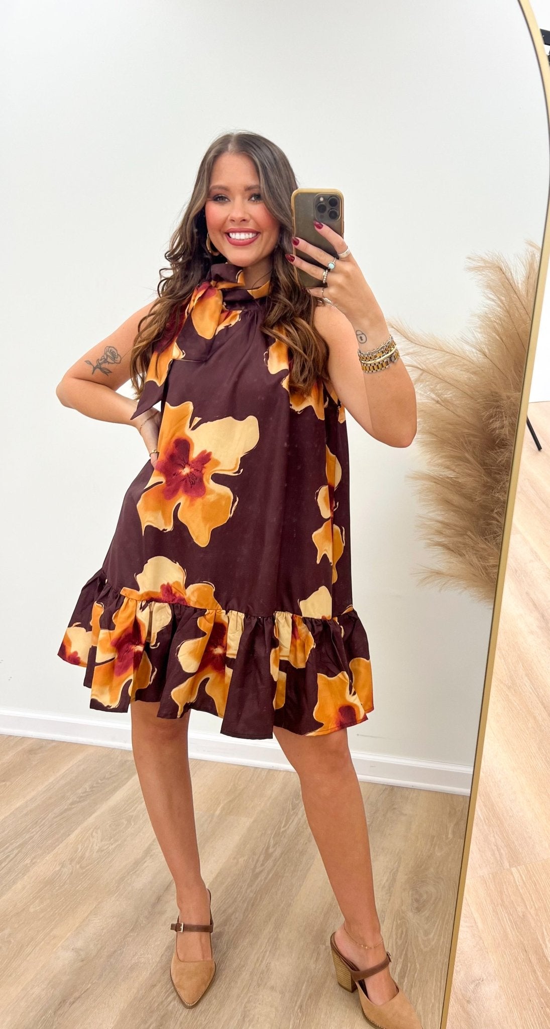Floral brick dress with a short hemline and tie neck