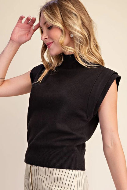 Sleeveless top with a tall neckband