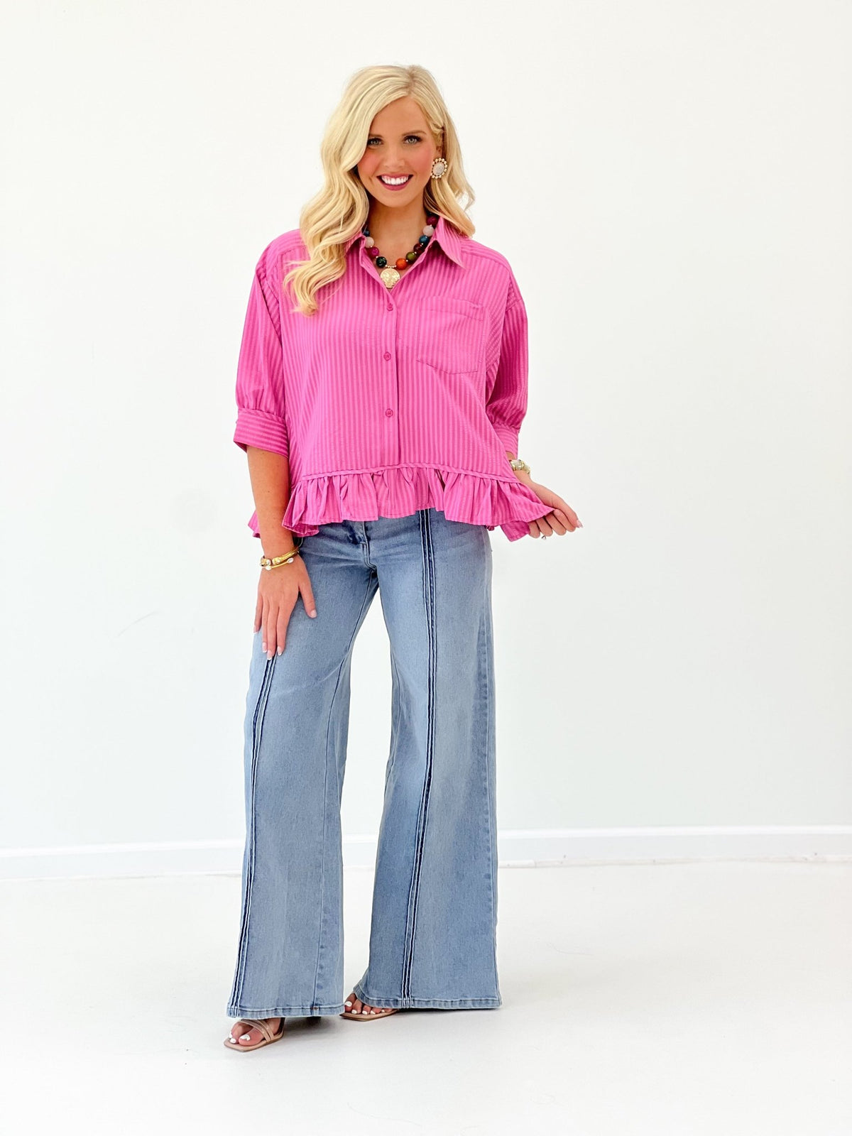Shirt with a button placket and ruffled bottom edge
