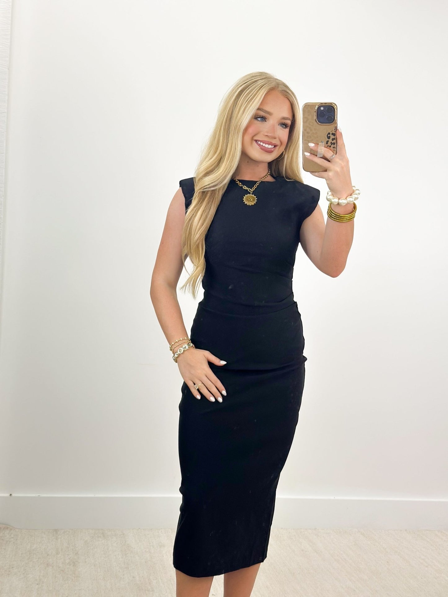 Sleeveless midi dress with a smooth drape