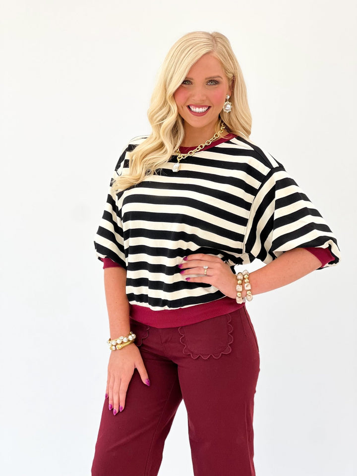 Black striped top with a round neckline