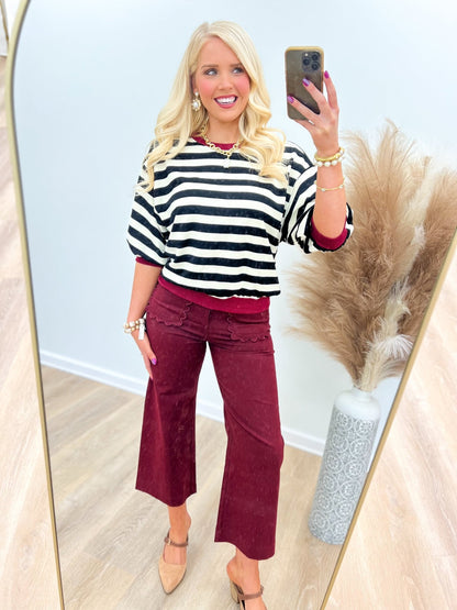 Black striped top with a ribbed neckband