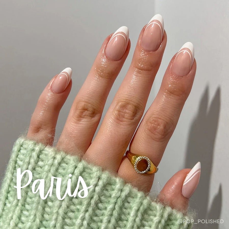Press-on nail set supplied with adhesive tabs