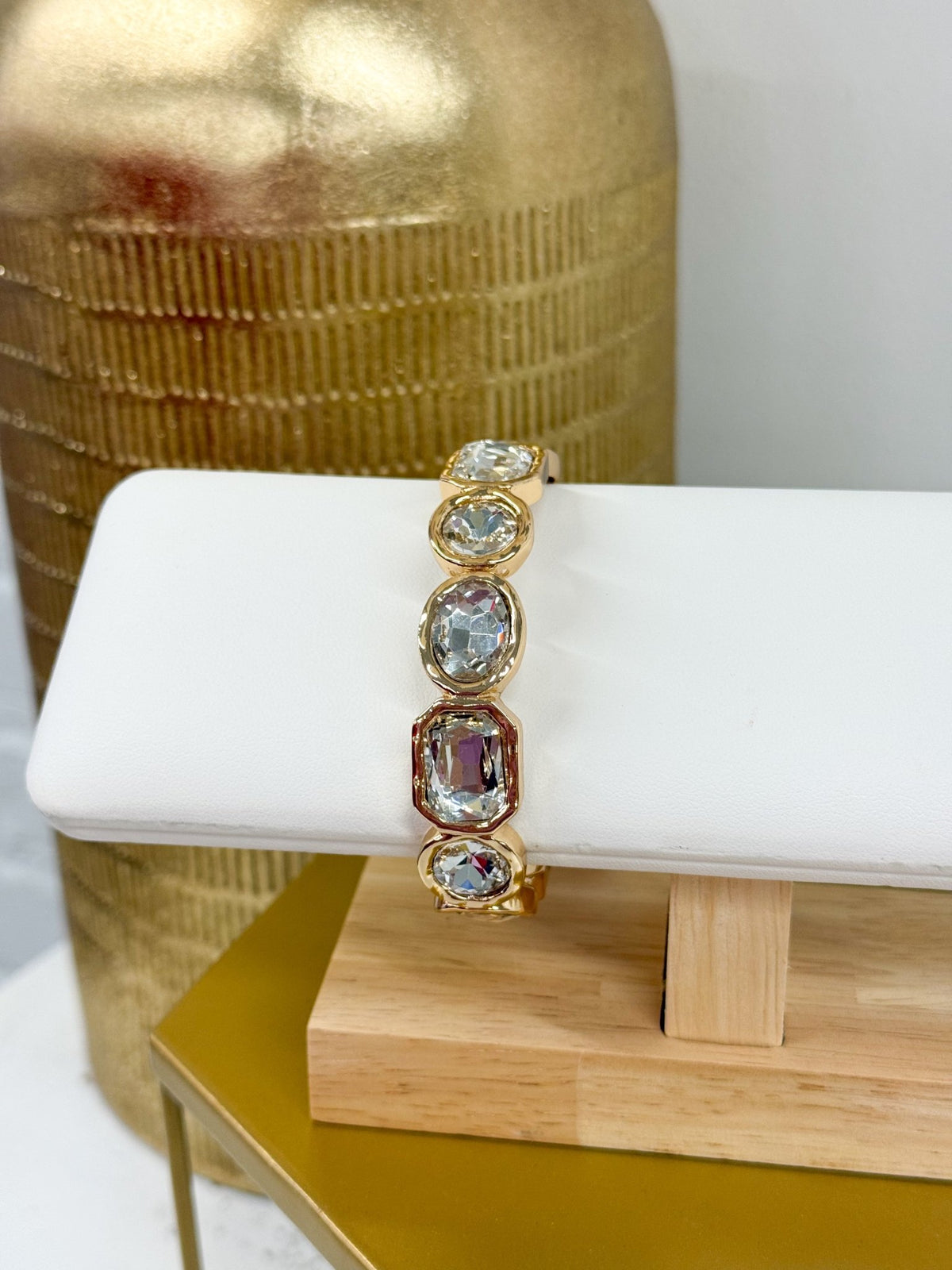 Mixed glass beads strung on a gold bracelet