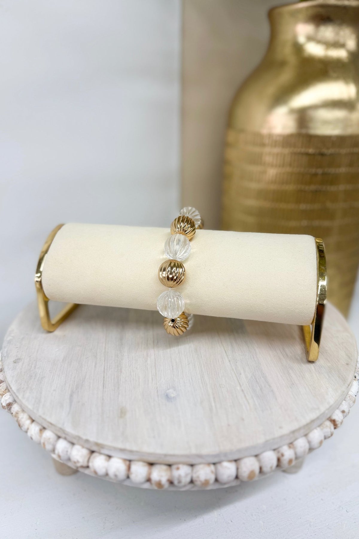 Gold bracelet with clear textured ball beads