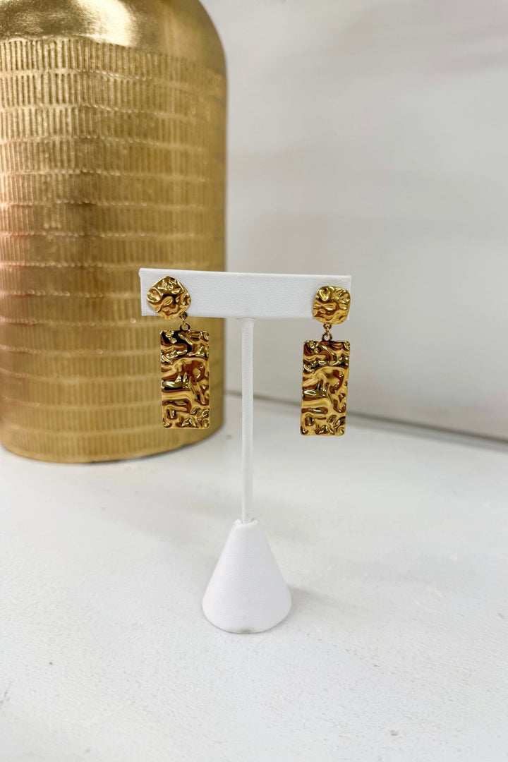 Gold earrings with a hammered texture