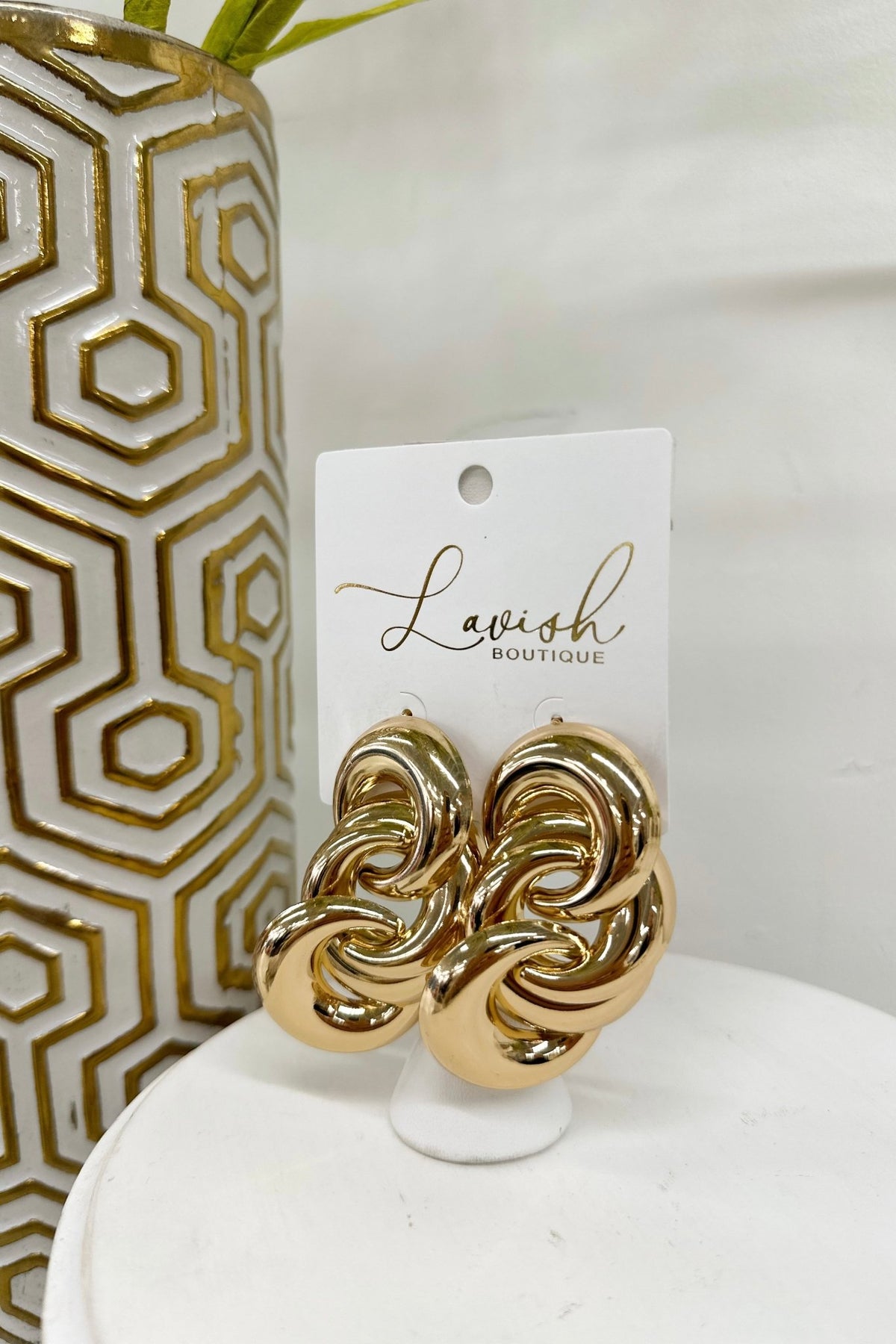 Gold earrings of chunky linked circles