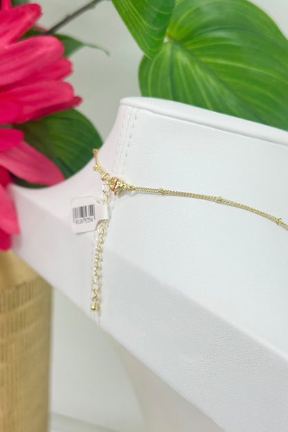 Simple gold cross pendant necklace