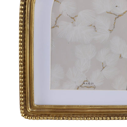 Gold arched photo frame trimmed in beading