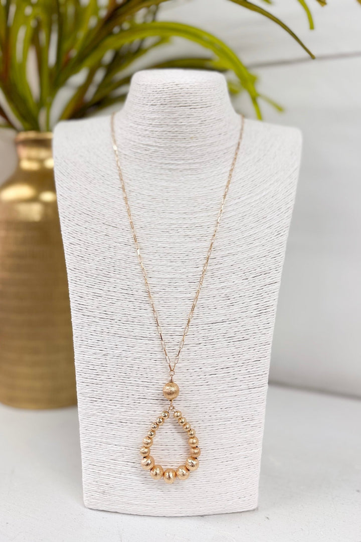 Gold satin teardrop pendant necklace