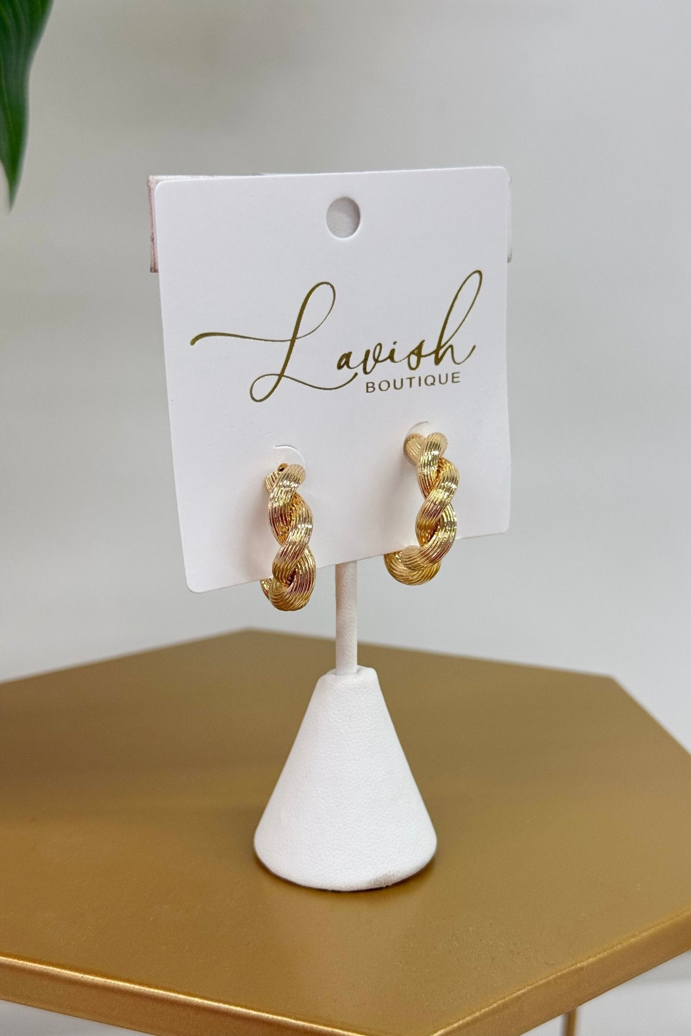 Twisted gold hoops with an open design