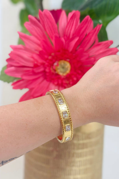 Gold bangle lined with diamond-look stones