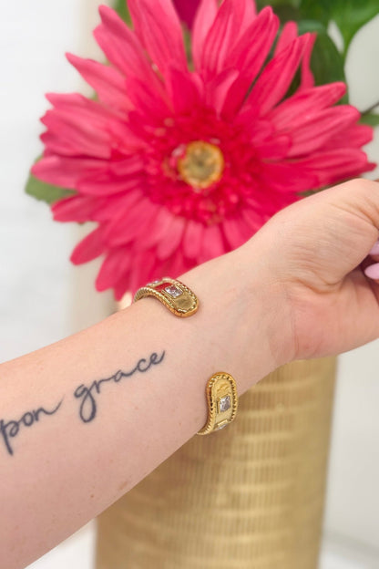 Gold diamond bangle with a slim profile