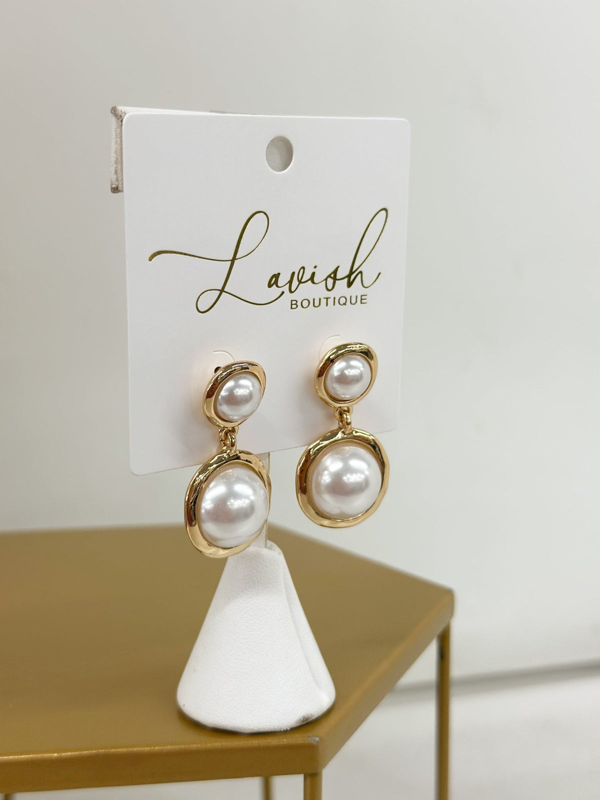 Double pearl dangle earrings in metal frames