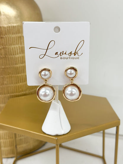 Gold-framed pearl drop earrings