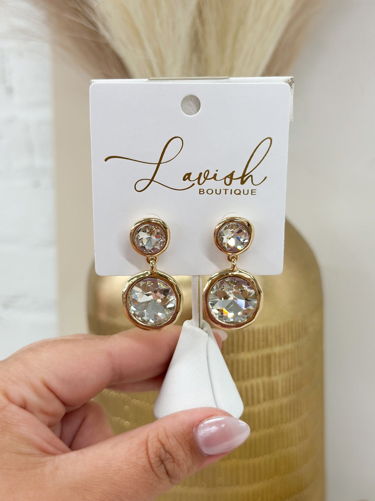 Dangle earrings with two pearls set in gold surrounds