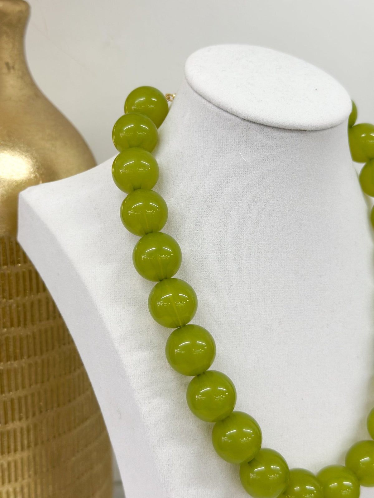 Smooth round beads forming a colored necklace