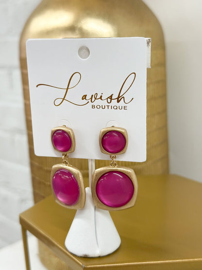 Gold earrings accented with hot pink stones
