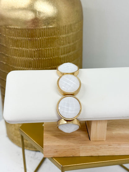 Round cut stone bracelet with a smooth polish