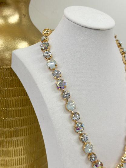 Faceted clear and iridescent glass stones on a gold-tone necklace