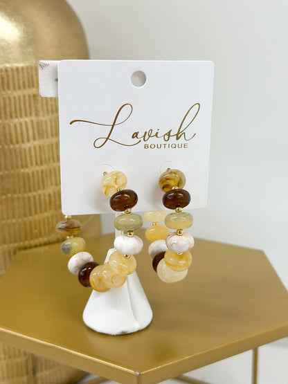 Marble beaded hoops in a soft beige tone
