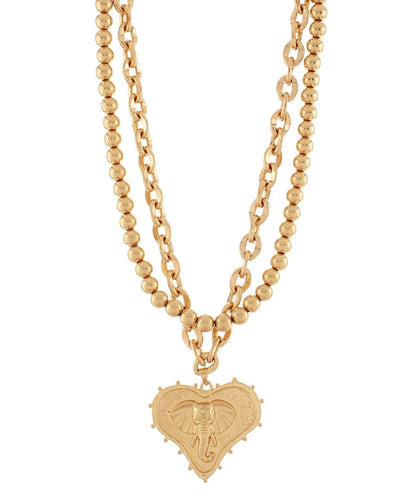 Mascot and heart pendants on layered worn gold chains