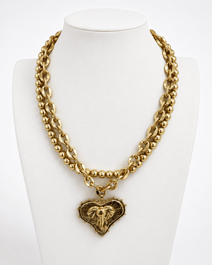 Worn gold layered chains with heart and mascot pendants