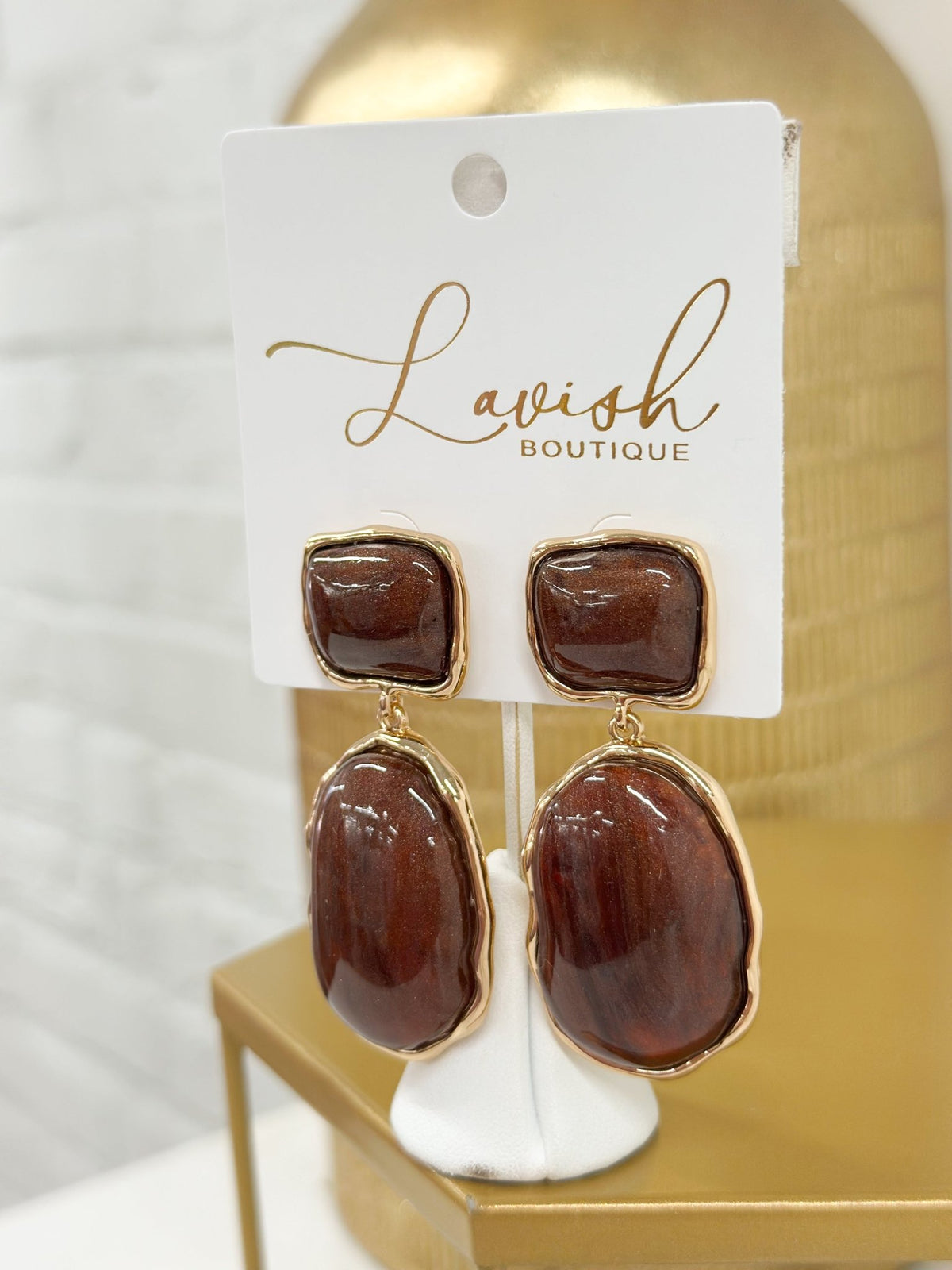 Oval and square marble drops on a single earring