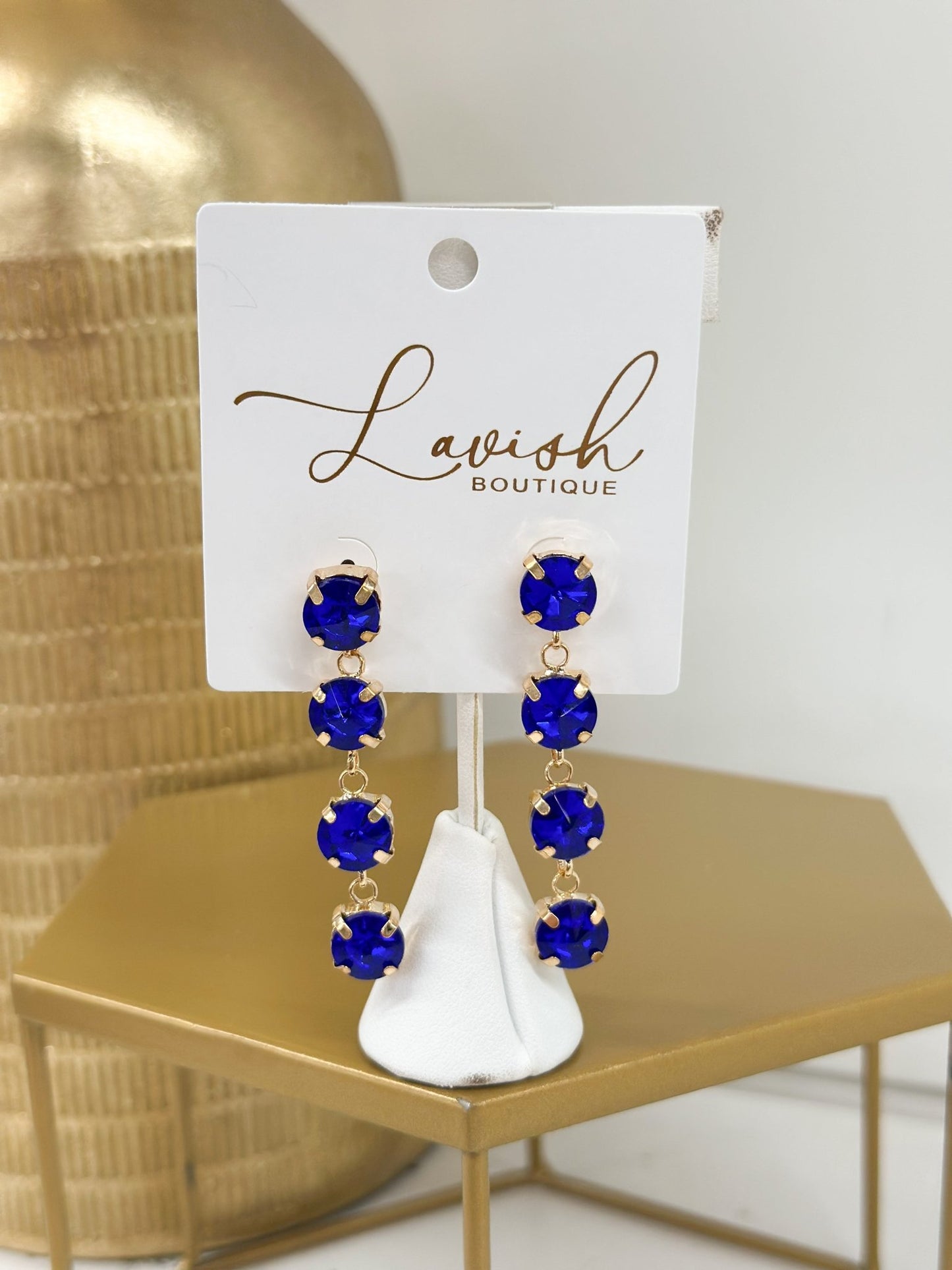 Faceted glass stones dropping from gold-tone posts