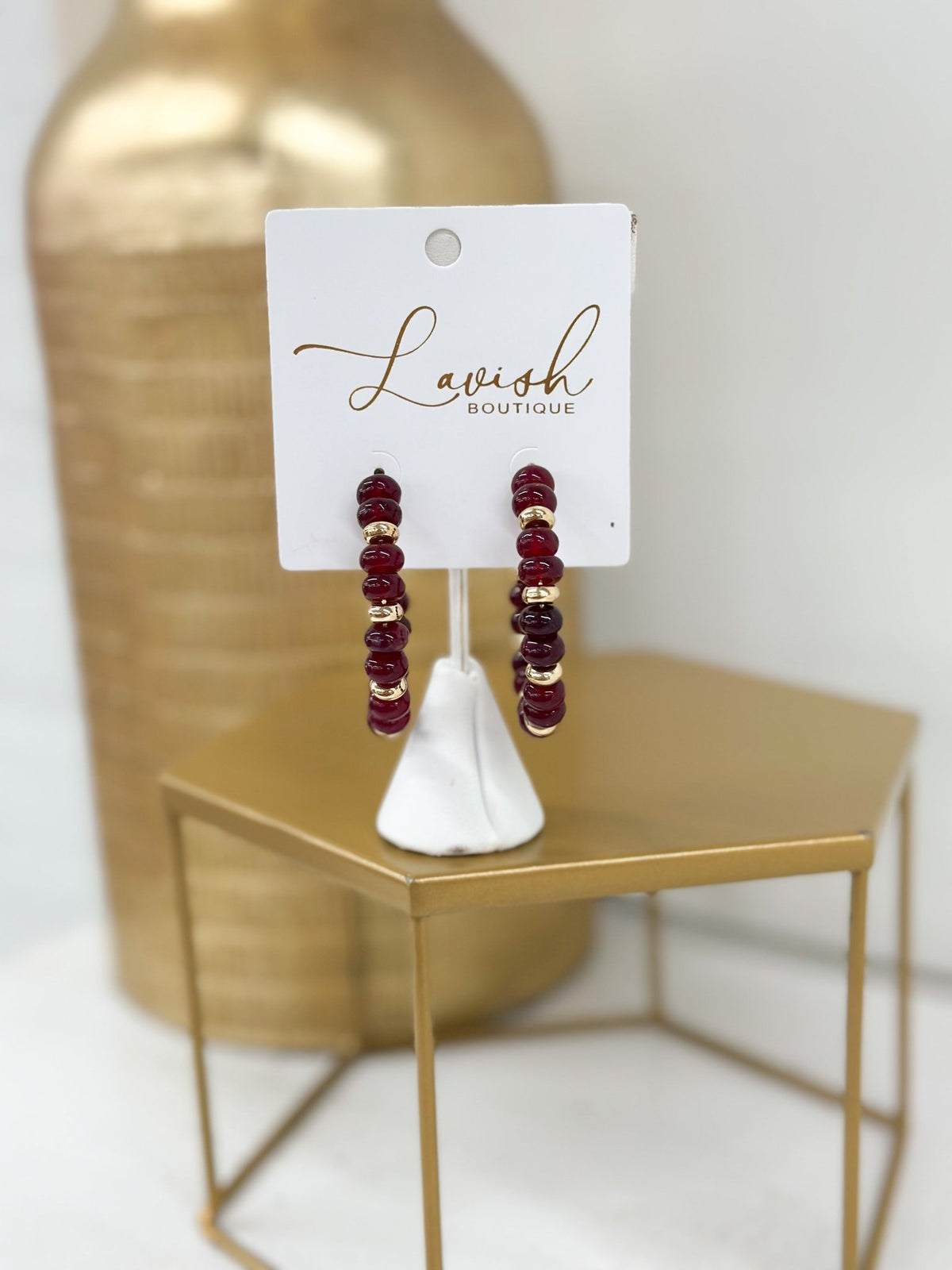 Beaded stone dangle earrings in gold tone