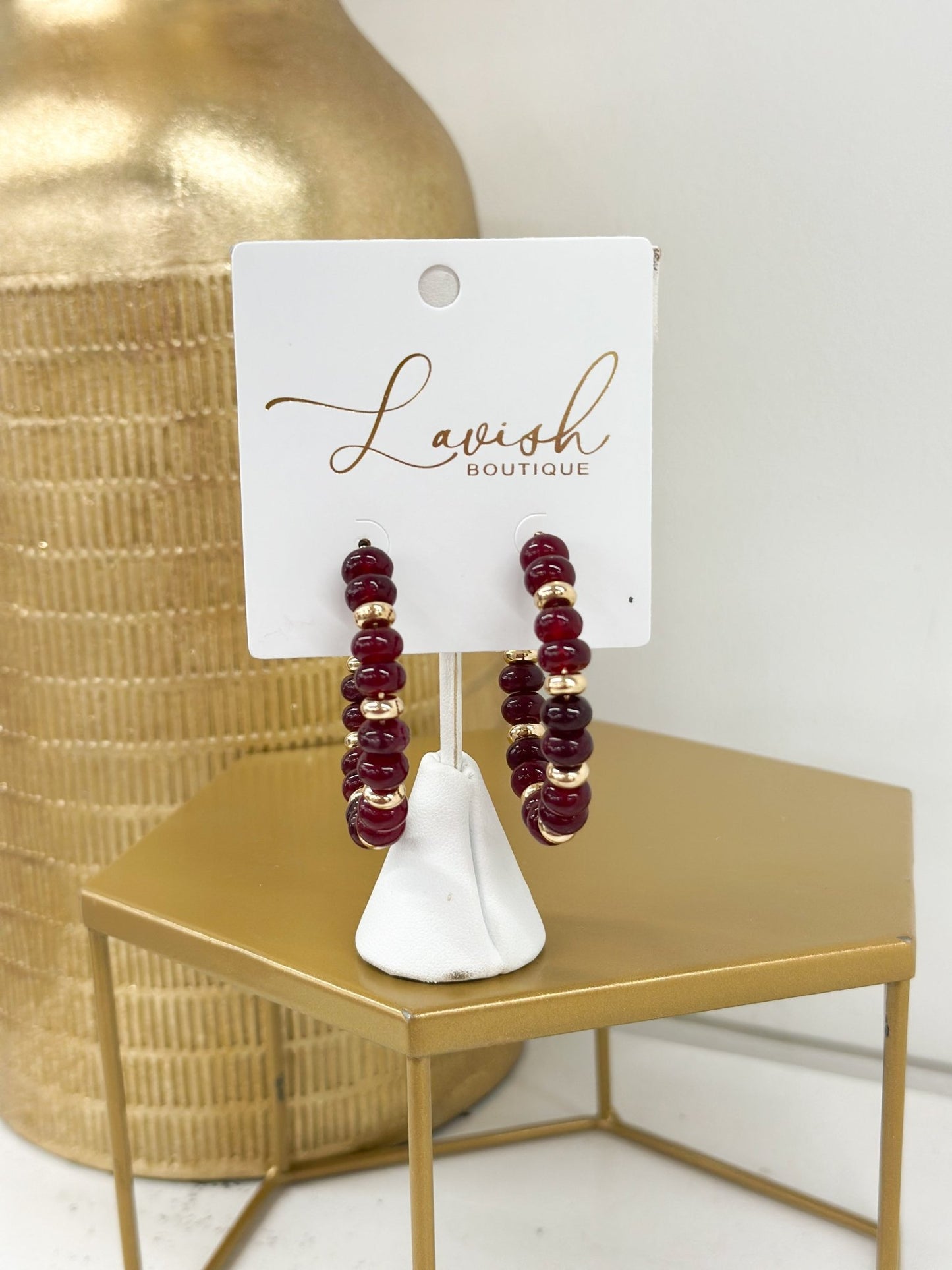 Stone drop earrings paired with gold-tone beads