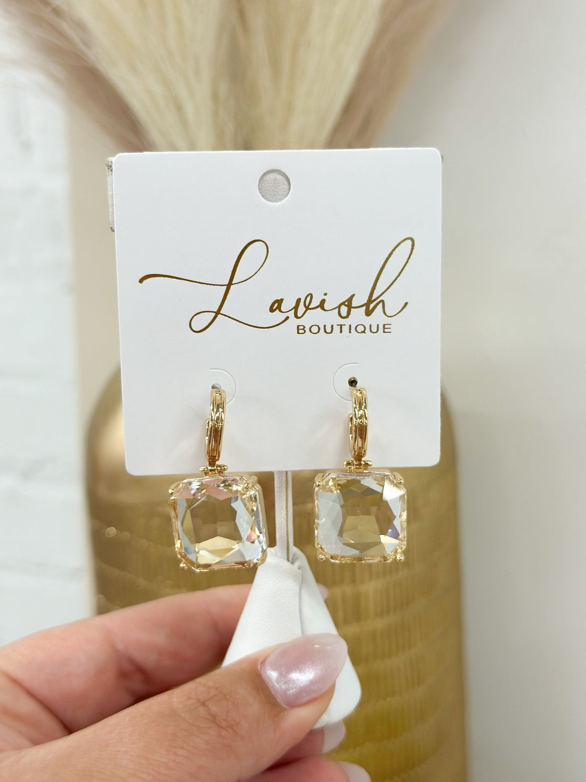 Dangle earrings with a single square stone