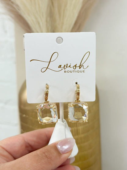 Dangle earrings with a single square stone