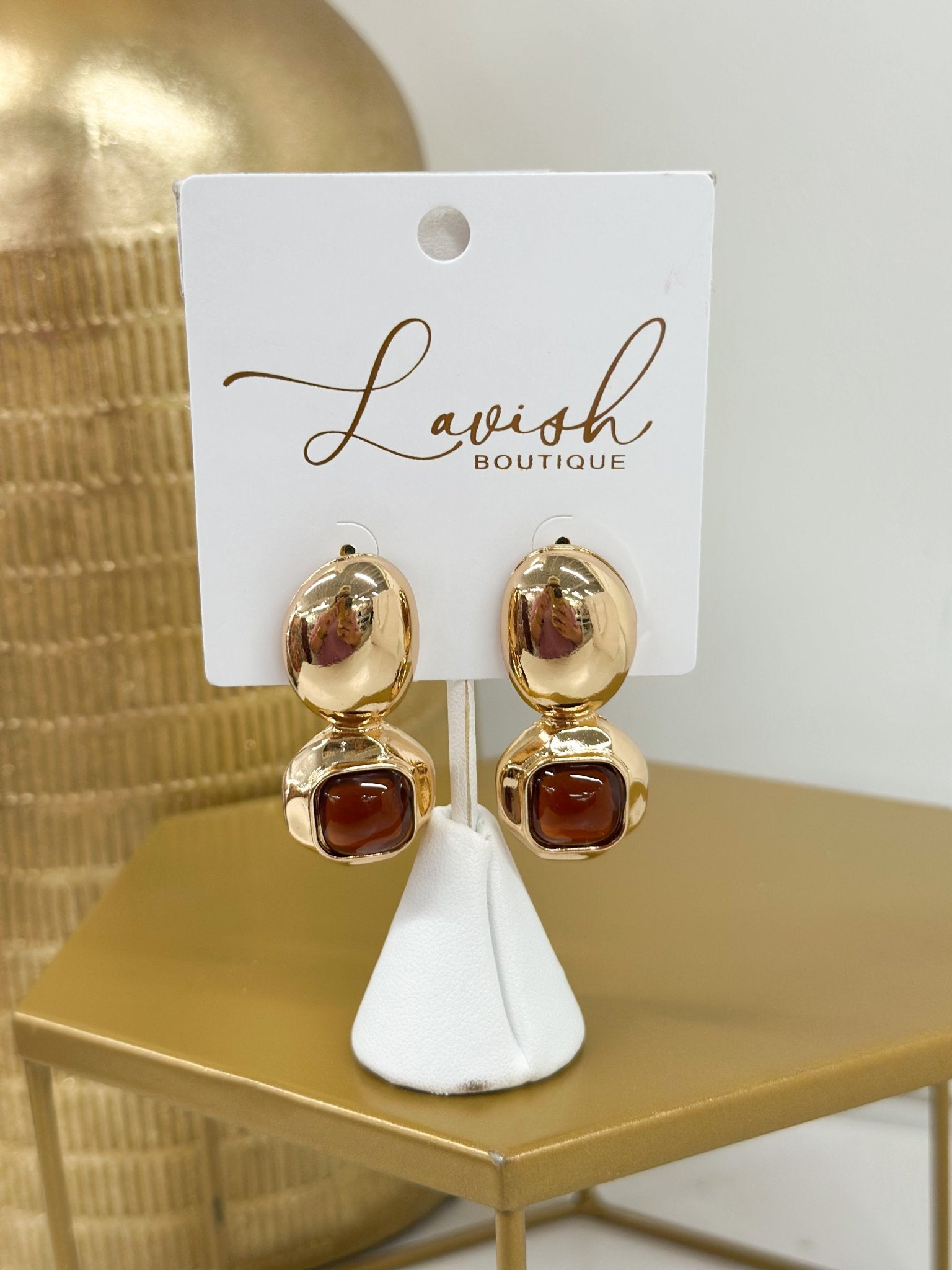 Statement earrings combining geometric stone shapes